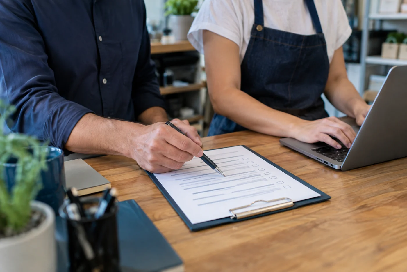 Business owners discussing a payment setup